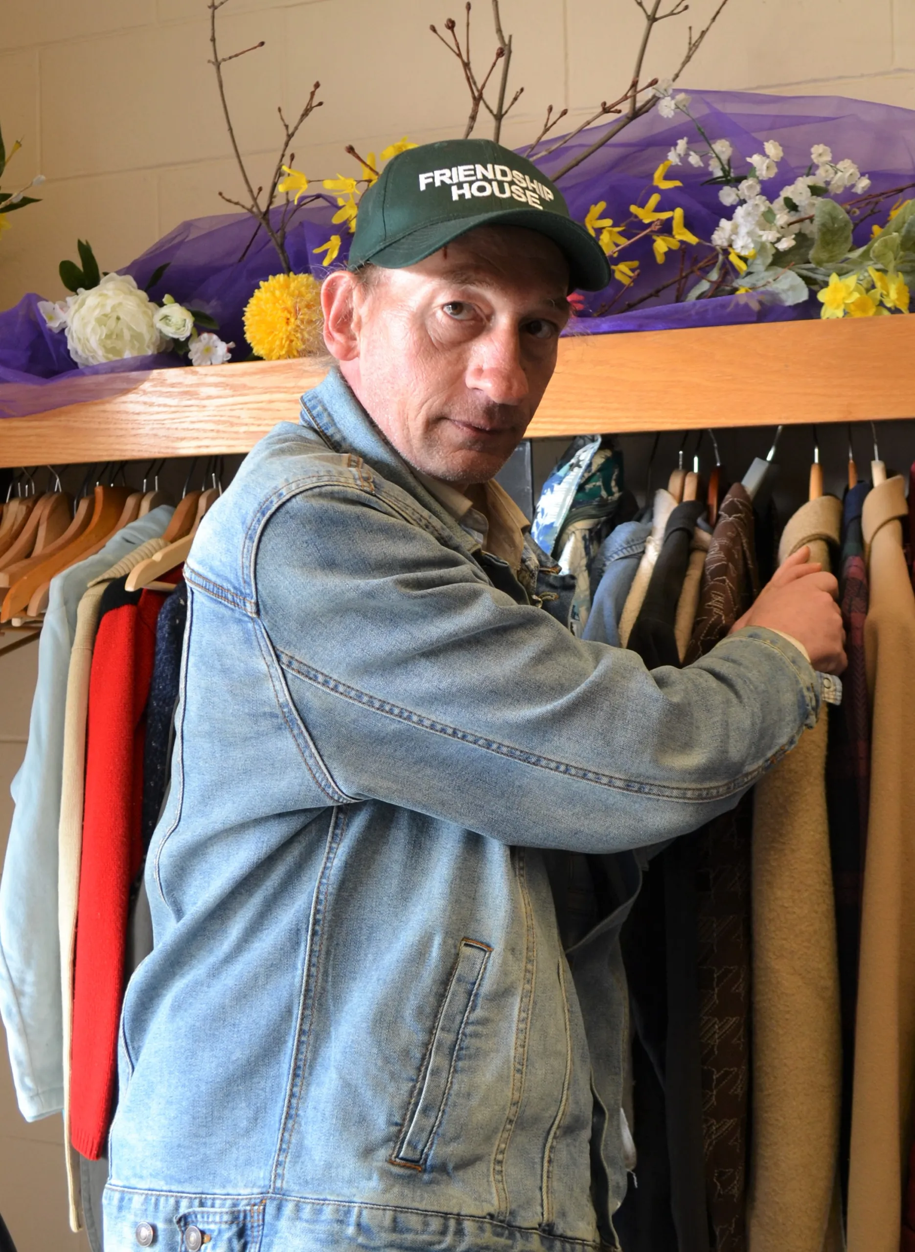 A guest looking through the Clothing Closet racks
